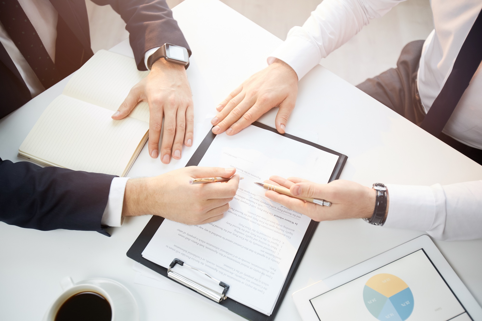 Discussing partnership contract at meeting